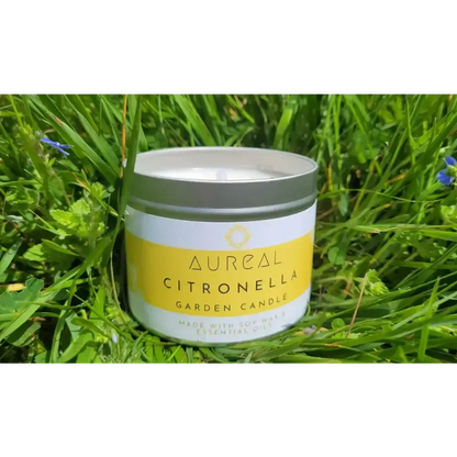 Aureal Citronella garden candle in a silver tin among long grass