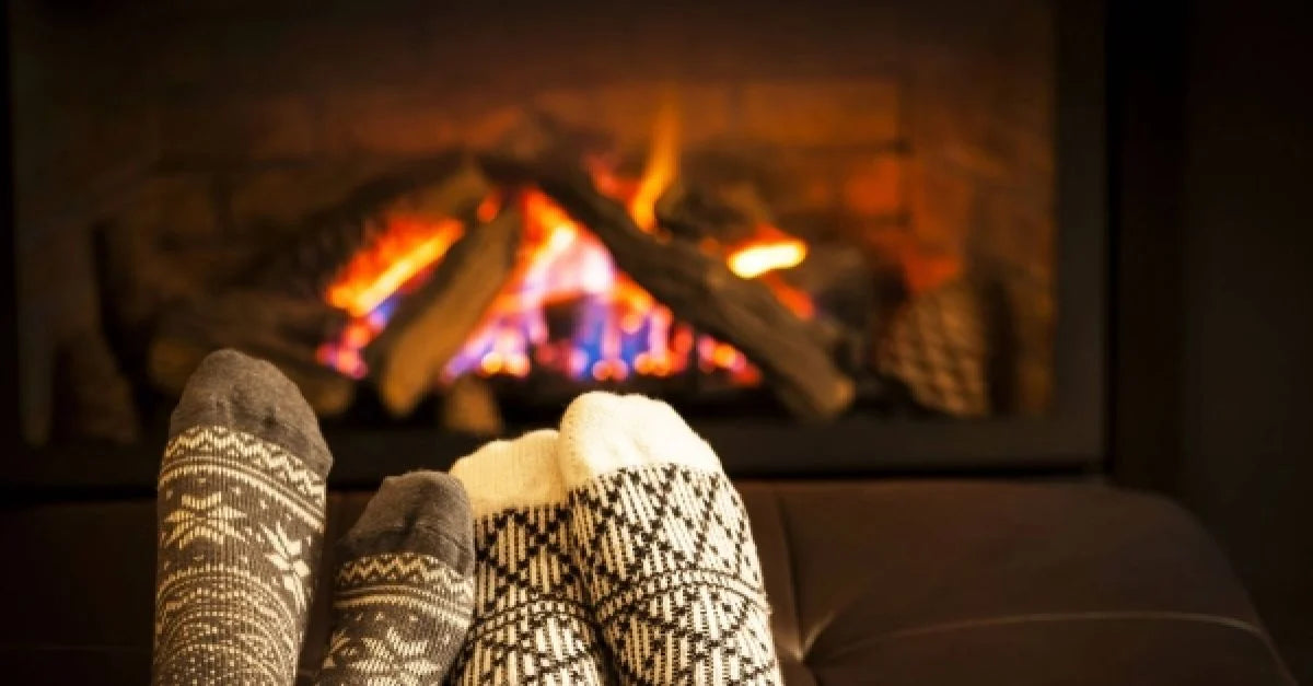 Feet in front of authentic glowing Irish Turf Fire