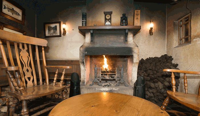 Authentic Irish cottage with Turf piled beside old fireplace