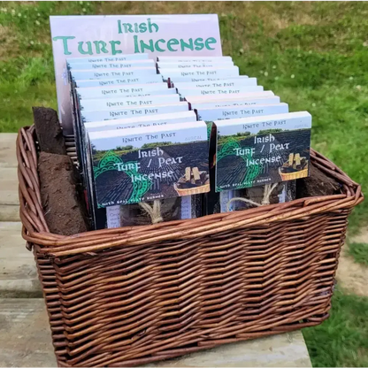 Wicker basket display of Irish Turf Peat Incense packs with an Irish Turf Incense sign